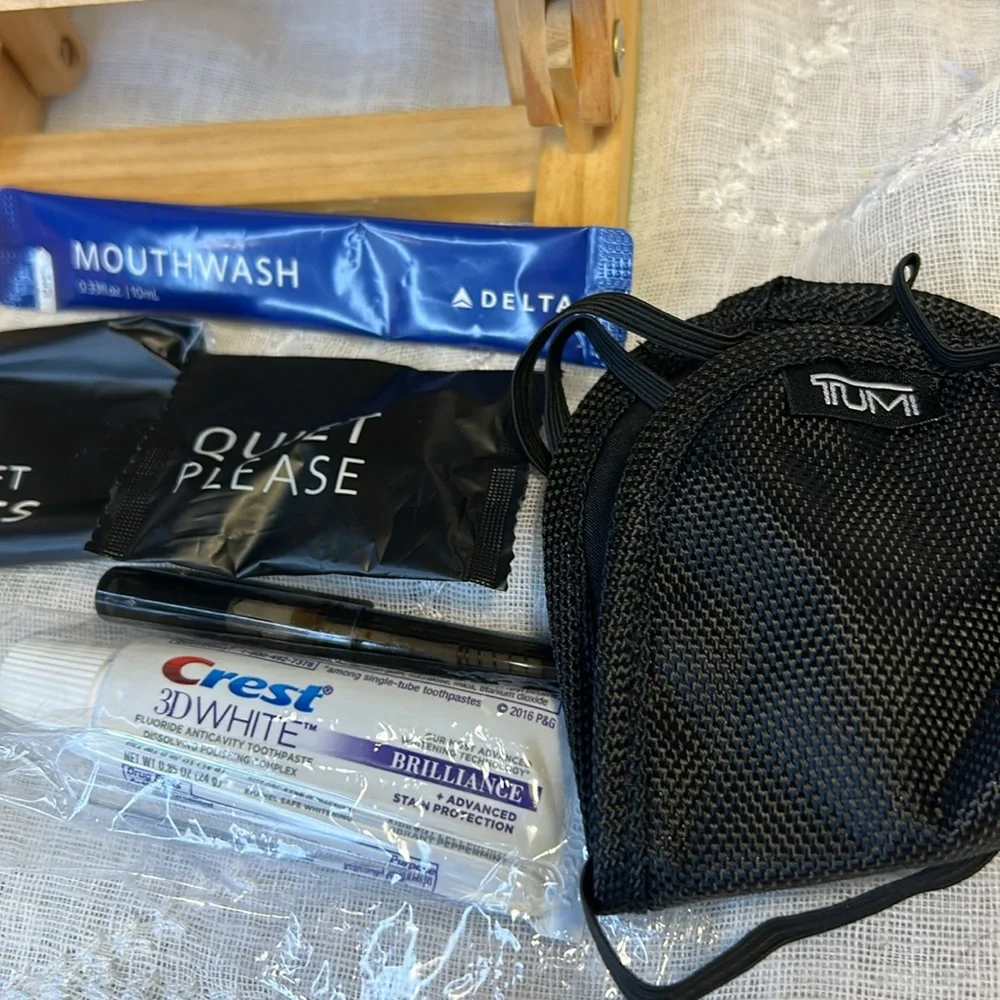 Tumi NWT cosmetic travel bag filled with goodies all new in packages